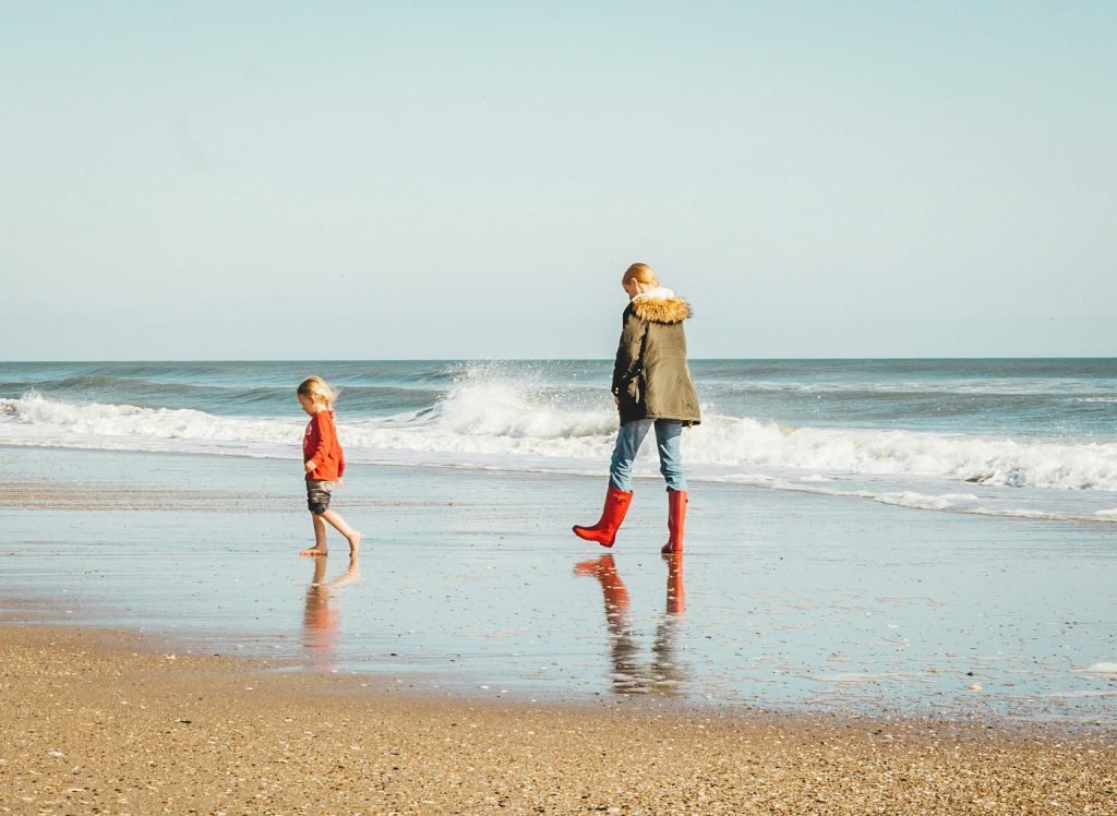 Australian parent and child walking together outdoors, sharing time and connection.